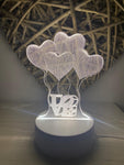 Mini lámpara de corazones en 3D, con luz led.