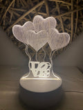 Mini lámpara de corazones en 3D, con luz led.